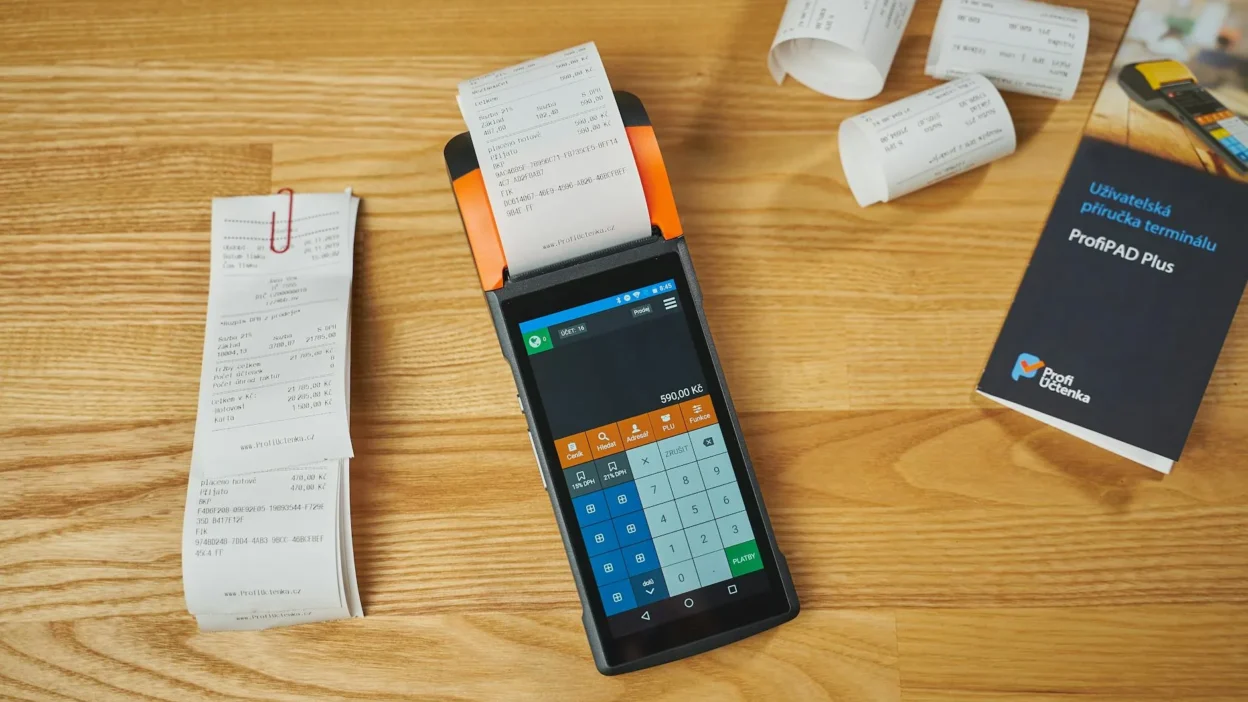 Organized cash envelopes with receipts sorted by budget category on a table