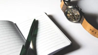 Printable monthly budget checklist with categories for housing, food, savings, and debt payments