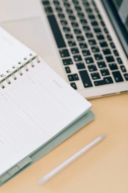 Clean Home Office Desk With A Budget Dashboard Notebook And