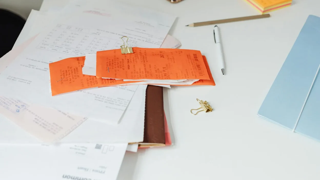 Budget paperwork checklist showing what financial documents to file, scan, or discard for organization.