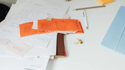 Budget paperwork checklist showing what financial documents to file, scan, or discard for organization.