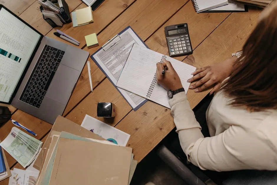 Organized Desk With Laptop Notebook Calculator And Coffee For Budget